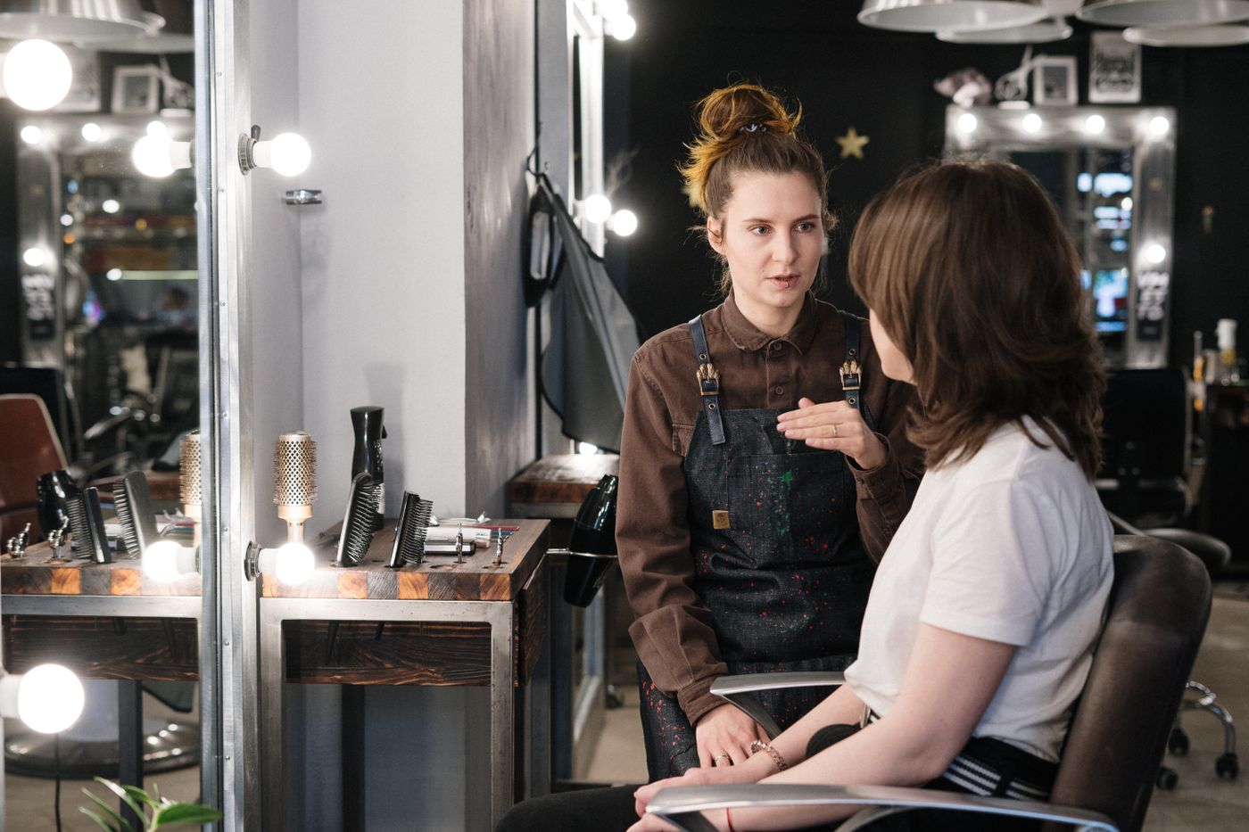 Hair stylist consulting with a client
